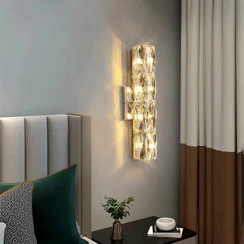 Gold Crystal LED Wall Light Sconce Dope Modern Elegant Wall Mount Lamp beside a bed in a modern bedroom