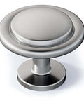 Close-up of a single knob from the 30 Pack One And One Quarter Inch Brushed Nickel Solid Zinc Alloy Euro Style Cabinet Knobs Round Drawer Pulls