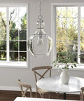 11-Inch Wide Pendant Light With Glass Shade In Brushed Nickel And Clear Finish above dining room table