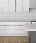 Champagne Gold Finger Edge Pulls Set Of 10 For Drawers And Cabinets installed in modern kitchen with white cabinets and wood floor