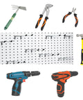 Badass Double Pegboard Hooks 15 Piece Set Crafted From Hella Tough Steel With Cushioned Rubber Tips holding various tools on pegboard.