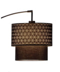 Gala Arc Floor Lamp In Black With Adjustable Arm, Double Kaleidoscope Fabric Shade glowing under soft lighting.