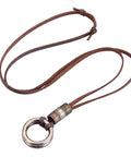 Top Shelf Handcrafted Leather Necklace For Men And Women Boasting A Fly Vintage Hippie Design With Adjustable Long Cord And Smooth Durable Alloy Cross Pendant In Classic Brown with a round metallic charm and brown strap.