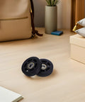 Universal Luggage Wheel Replacement Kit With Quiet Roll, Four Swivel Wheels, Easy Install For Travel Bags And Suitcases, Smooth 360 Degree Rotation, Durable Plastic Build For Everyday Travel; two black wheels on floor