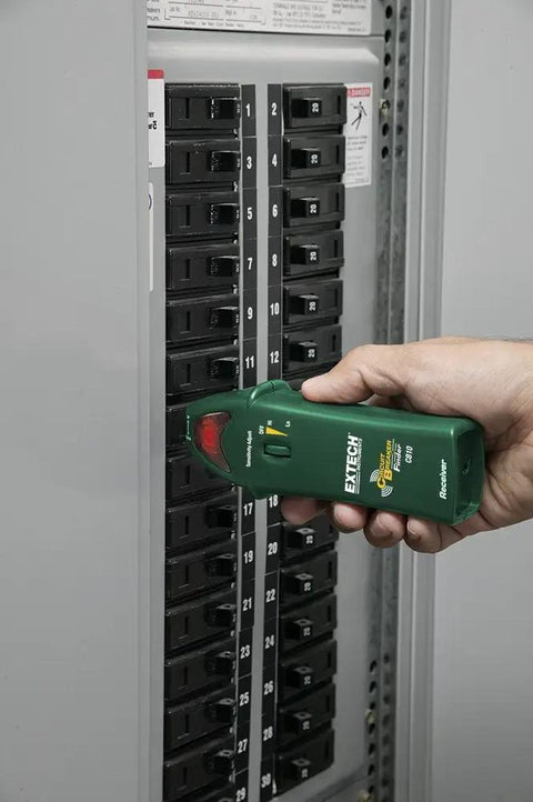 Person using 3-in-1 Electrical Troubleshooting Kit with circuit breaker finder on electrical panel for fast, accurate diagnosis.