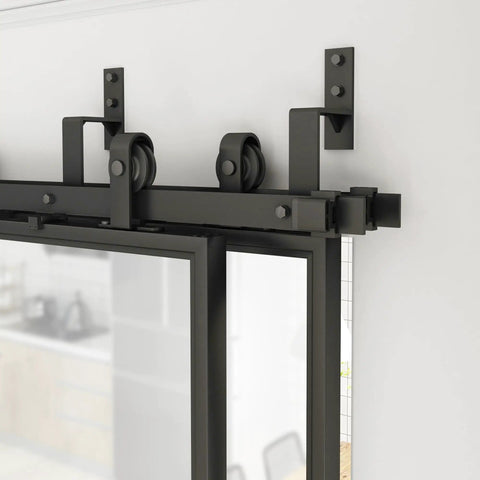 Close-up of the black carbon steel frame and hardware of the Double Bypass Frosted Tempered Glass Barn Door Kit 144 By 84 Inches With 12 Feet Double Hardware Kit Soft Close And Black Carbon Steel Frame 4 Panels Sliding Door Set No Fuss Install
