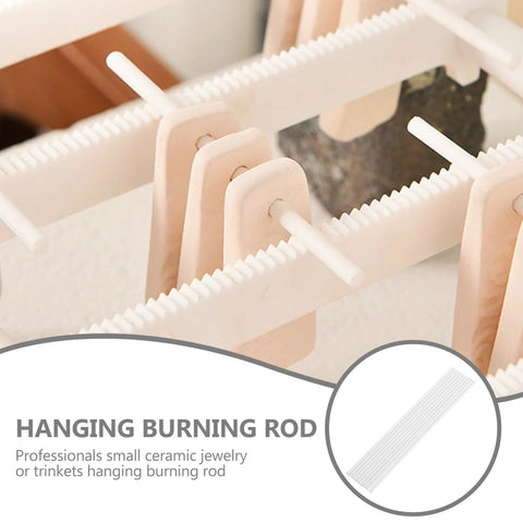 Close-up of ten white alumina kiln hanging rods for jewelry bead firing; 3.94 in long, cone 10 rated, pack of 10