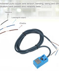 Inductive Proximity Sensor With 4mm Sensing Range, DC 6-36V, 3-Wire PNP NC, blue rugged housing, connected wires on white background