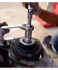 Mechanic using 18 Piece Hub Suspension Nut Removal Tool Socket Kit For Shock Absorber Struts on car suspension system
