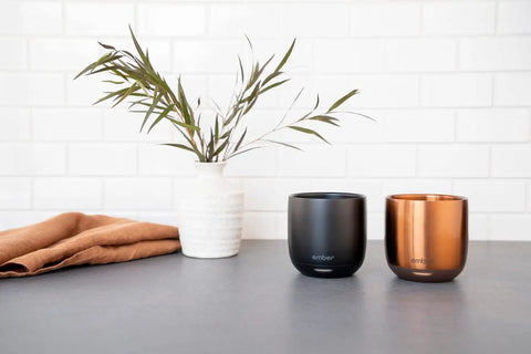 Renewed 6 Oz Smart Heated Coffee Mug With App Precision Temp Control And Solid Battery Life on kitchen counter.
