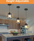 Black Pendant Lights For Kitchen Island With Glass Shades hanging over a kitchen island, highlighted for adjustable height.