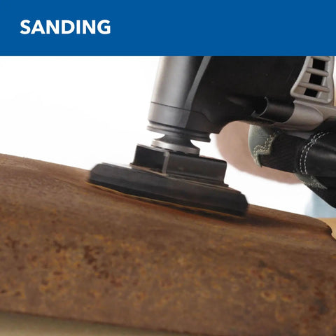 Zero Hassle 3.5 Amp Oscillating Multi Tool With Variable Speed cutting rust on wood surface with sanding attachment.