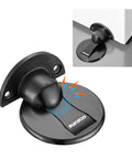 Heavy Duty Magnetic Floor Door Stopper That Keeps Your Door Locked In Place With Premium Peel And Stick Tape No Drilling Headache For House Or Work Space Black on smooth surface, showcasing its round base and magnetic cap.