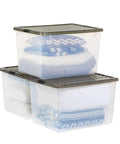 Big Ticket Clear Storage Bins 144 Quart 3 Pack Stackable Containers With Snappy Buckles Grooved Lid Handles Every Heavy Haul For Zero Drama Household Organization filled with blankets.