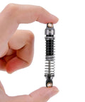 Close-up of a 59mm Long Threaded RC Shocks Oil Dampers Upgrade For TRX4M TRX4MT 1/18 Crawler held between fingers.