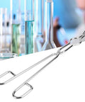 Top Tier Heavy Duty Stainless Steel Crucible Tongs With Non Slip Paws And Rock Solid Beaker Clamps For Zero Sweat High Heat Chemistry Lab Tasks Daily Featuring Aircraft Class Rivet Construction in laboratory setting.
