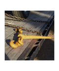 Heavy Duty Ratchet Load Binder For 3/8 To 1/2 Inch Grade 70 Transport Chain, shown on flatbed with yellow finish.