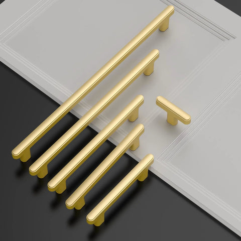10 Pack 5 Inch Brushed Gold Cabinet Handles For Kitchen Cabinets And Drawers arranged on tabletop