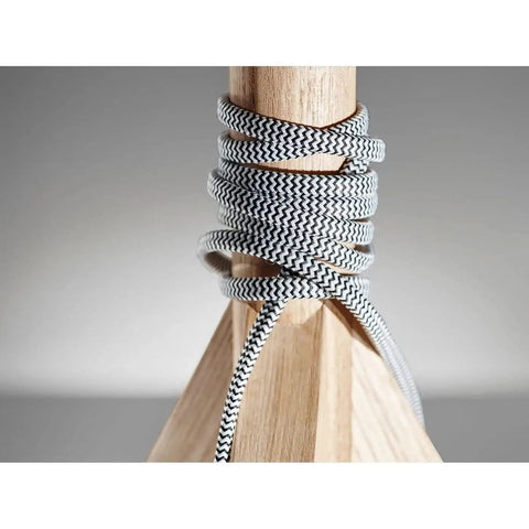 Close-up of Eden Table Lamp With Natural Ash Wood Tripod Base, featuring a black white fabric cord wrapped around the tripod