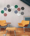 Hexagon Tile Peel And Stick Backsplash Kit displayed on a wall, showing colorful geometric patterns in a modern seating area.