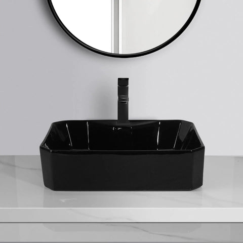USZWBY Vessel Sinks Bathroom Vessel Sink with Faucet Hole Ceramic Wash Basin Hotel Apartment Creative Art Above Counter Bathroom Bowl Sink in black ceramic on a marble countertop.