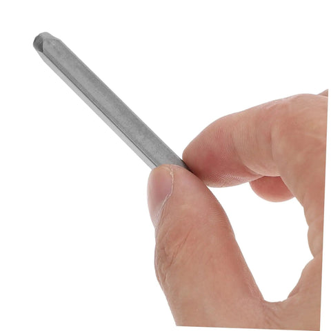 Hand holding a punch tool from Awesome 37 Piece Metal Stamping Kit With Letters Numbers Heart Symbols And Punches For DIY Crafting