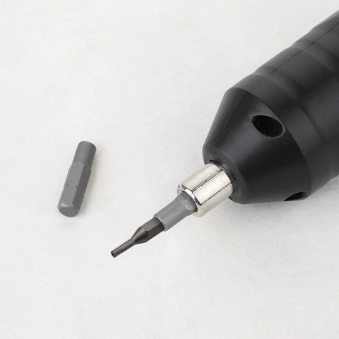 Knockout 4 Pack 1/4 Inch To 4mm Hex Screwdriver Bit Adapter With Solid Magnet and Plug And Play Design for Heavy Power Tools and Tight Garage Builds Ready To Roll No Sweat Setup, close-up of adapter in tool.