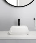 USZWBY Vessel Sinks Modern Minimalist Creative Sink Home Art Above Counter Basin Balcony Bathroom Ceramic Wash Bathroom Bowl Sink on a marble countertop with a black faucet.