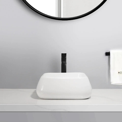 USZWBY Vessel Sinks Modern Minimalist Creative Sink Home Art Above Counter Basin Balcony Bathroom Ceramic Wash Bathroom Bowl Sink on a marble countertop with a black faucet.