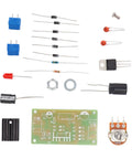 Built Tough Lm317 Adjustable Regulated Power Supply Kit With Ac Dc Input And 2200Uf Filter Cap In Rugged Abs Box components laid out on a white background.