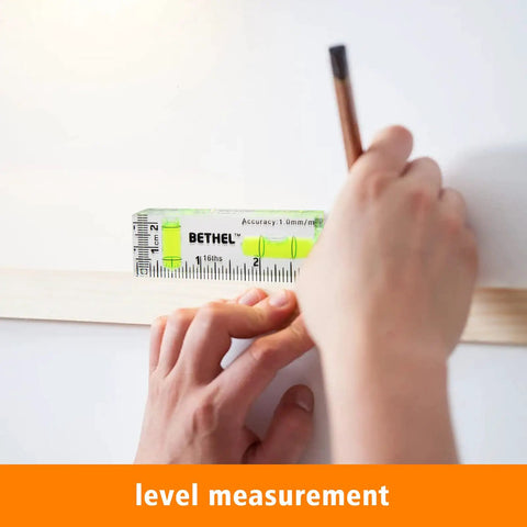 Compact Pocket Bubble Level Mini Spirit Level Acrylic With 90 Degree And 180 Degree Angles 2.95 Inch Portable Tool Imperial And Metric Scales Durable DIY Helper For Quick Horizontal Checks In Tight Spaces. Used for level measurement on a wall.