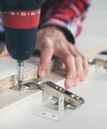 Beefy Heavy Duty L Brackets Set With Screws, 16 pack cold rolled steel being installed on wood shelf for stable support