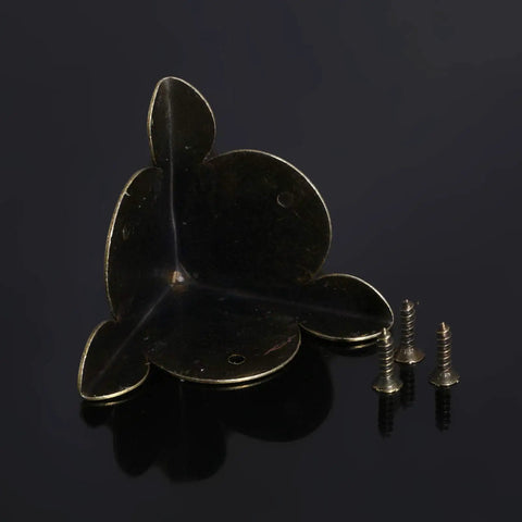 Solid Antique Bronze Corner Protectors, 12 Piece Heavy Duty Furniture Edge Guards showing corner protector with screws.