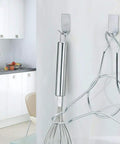 Ultra Strong Stainless Steel Adhesive Hooks For Wall Mounting Holds Hats Caps Keys And Kitchen Utensils Up To 5 Lb Waterproof Wall Rack Hooks 20 Pack For Kitchen Bathroom Cabinets shown holding kitchen utensils in a modern kitchen setting.