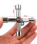 Hand holding one key from the Ten Piece Electrical Cabinet Key Set With Rustproof Zinc Alloy Four Way Utility Keys Triangle Square And Panel Cross For Faucet Gas Meter Valve Spigots And Electrical Cabinet Access