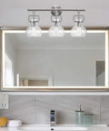 All In One Bathroom Vanity Set With A 3 Light Fixture, Towel Bar, Toilet Paper Holder, Towel Ring, And Robe Hook In Brushed Nickel With Clear Glass