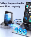 Badass M2 NVMe SSD Docking Station With USB4 40Gbps Transfer Speed Perfect For All PCIe Gen4 Drives And 2280 2230 2242 2260 22110 Formats Plug N Play For Your Rig Fast connected to laptop with glowing data transfer indicators.