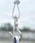 Rock Solid 316 Stainless Steel Clevis Slip Hook With Swivel Lift And Safety Latch 5/16 Inch 1430 Lbs Rigging Accessory hanging from cable.