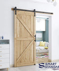 Heavy Duty Sliding Barn Door Hardware Kit In Black, Includes Pull Handle Set And Floor Guide, Fits 34 To 36 Inch Door Panels, showing wood door installation