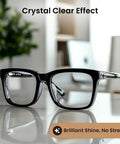 Eyeglasses in a black plastic frame, front view on a glossy reflective surface.