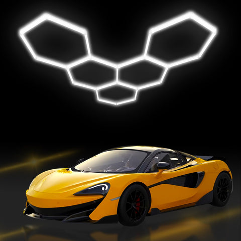 Hexagon Garage Lights LED 25 Pack 220W 26400LM 6500K Daylight White Ceiling Lighting illuminating a yellow sports car