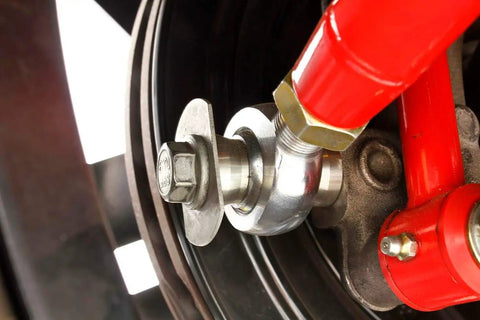 Rear Adjustable Toe Rod Kit With Spherical Rod Ends And Red Powder Coat For Chevy Camaro 2016 close-up view of spherical joint and bolt.