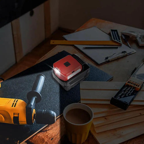 Battery Converter For Milwaukee 18V Batteries With USB Charger, DC Port And 3W LED Work Light on a workshop table.