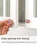 Person using Rock Solid One Point Four Inch Round Beech Wood Cabinet Knobs Featuring A Snazzy Abstract Red Oil Painting Vibe.