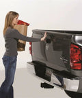 Person using Tailgate Assist Kit for Ram 1500 2002 to 2008 and Ram 2500 3500 2003 to 2009, smooth tailgate lowering.