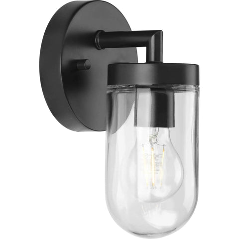 Black modern wall sconce with clear glass shade showcasing bulb, contemporary lighting fixture for hallways or bathrooms.