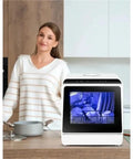 Totally Game Changing Compact Dishwasher With Built In Water Tank Featuring One Touch Start And Quick Wash Cycles To Deliver No Sweat Cleaning For Tiny Kitchens And Hectic Apartment Life Today on kitchen counter with woman.