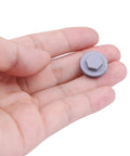 Hand holding a single silver gray plastic screw cover, part of 400 Pack Silver Gray 8mm Roofing Screw Covers, Durable Plastic Snap-On Protectors.