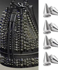 Ten 7x14mm metal cone spike screw-back studs for garments; silver finish shown with a studded bag.
