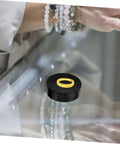 Compact Electric Rotating Turntable Stand For Jewelry Display, 360 Degree Silent Base showcasing a gold ring on a glass surface.